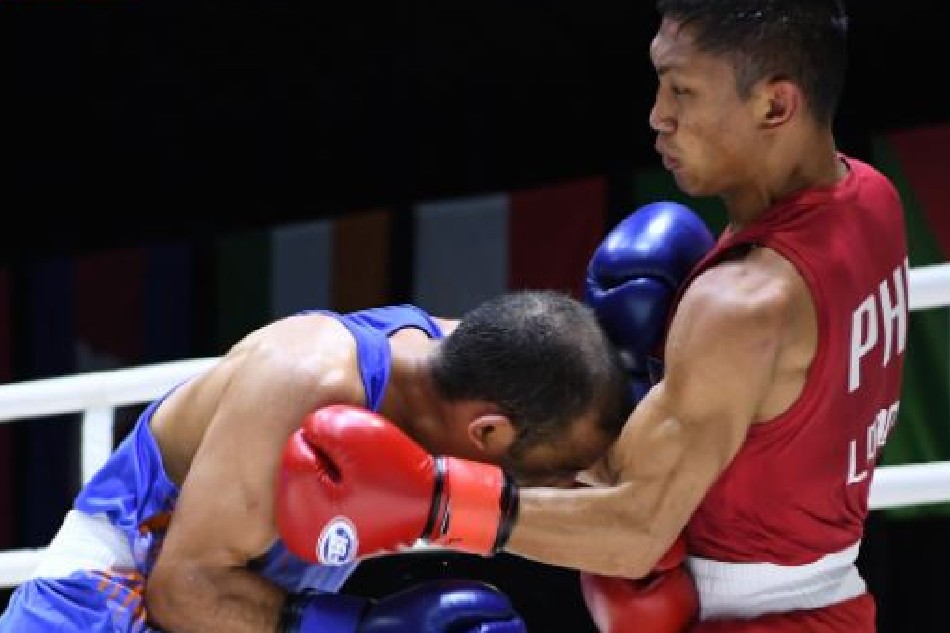 Rogen Ladon (right) connects with a left uppercut to Amit Panghal of India during their men's flyweight gold medal bout in the 2022 Thailand Open International Boxing Tournament at the Angsana Laguna Phuket Resort Hotel. Handout photo