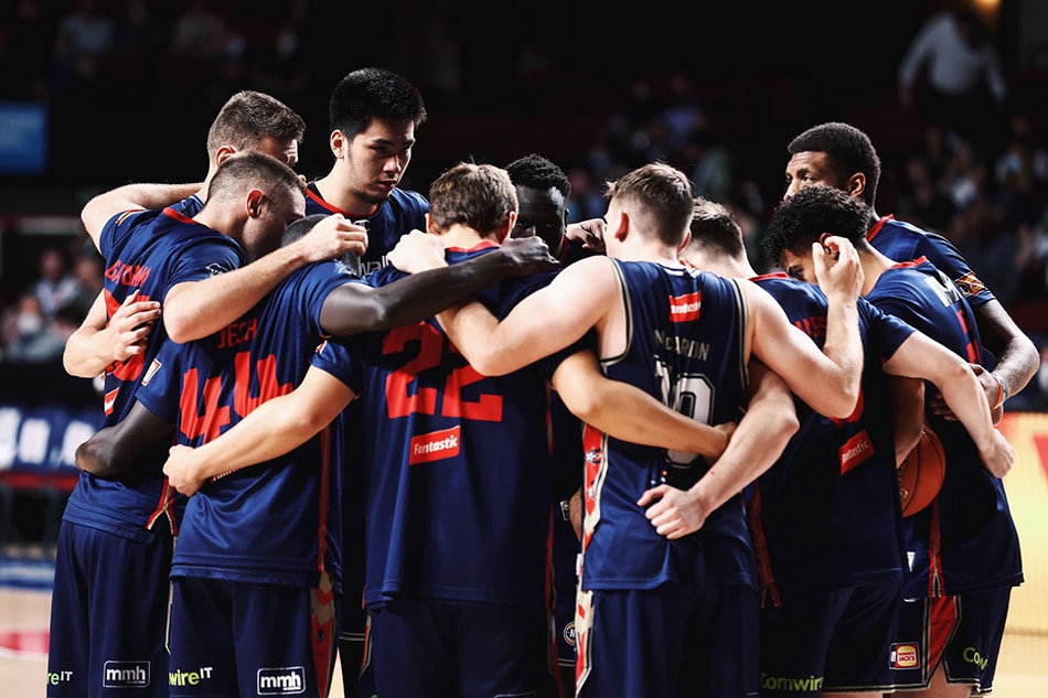 Kai Sotto and the Adelaide 36ers in a team huddle. Photo courtesy of the 36ers.