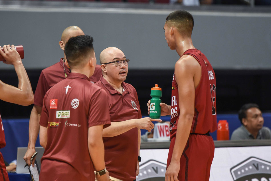 UP head coach Goldwin Monteverde gives instructions to forward Zavier Lucero during their UAAP Season 84 second round game against the NU Bulldogs. UAAP Media.