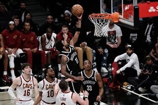 Irving shines as Nets punch playoff ticket over Cavs