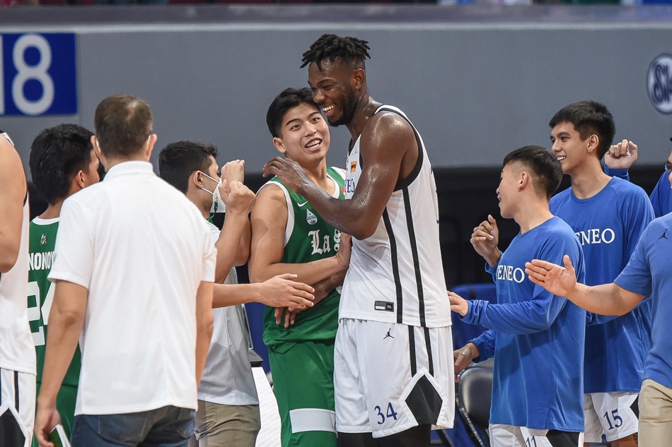 La Salle's Joaqui Manuel shakes hands with Ateneo center Ange Kouame after their UAAP Season 84 second round game. UAAP Media.