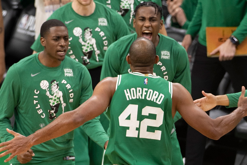 Boston Celtics center Al Horford (C) is greeted by hi s teammates after making a shot during the third quarter of the Eastern Conference first round playoff game two between the Brooklyn Nets and Boston Celtics at the TD Garden in Boston, Massachusetts, USA, 20 April 2022. CJ Gunther, EPA-EFE.