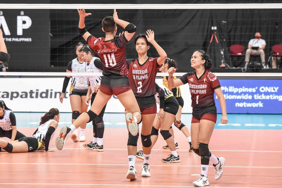 The UP Fighting Maroons celebrate after scoring against the UST Golden Tigresses in their UAAP Season 84 first round game. UAAP Media.
