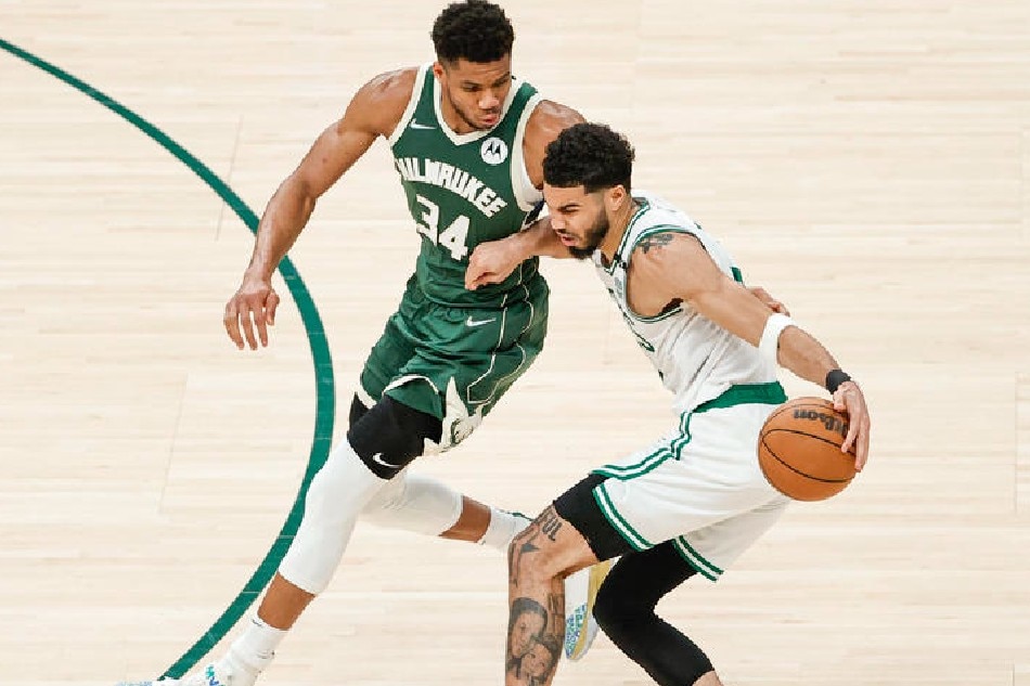 Bucks forward Giannis Antetokounmpo (left) defends Celtics forward Jayson Tatum in Game 6 of their East semis duel on May 13, 2022. Kamil Krzaczynski, Shutterstock Out/EPA-EFE