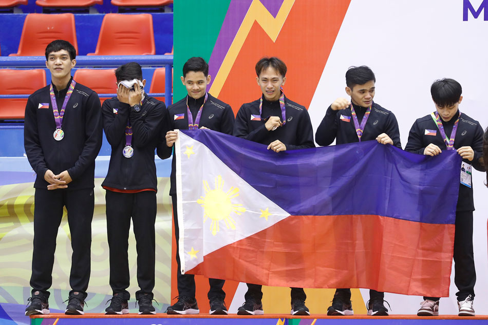 Members of team Philippines react on the podium after taking the second place in the team competition of the Artistic Gymnastics events at the 31st Southeast Asian Games (SEA Games 31) in Hanoi, Vietnam, 13 May 2022. Luong Thai Linh, EPA-EFE.
