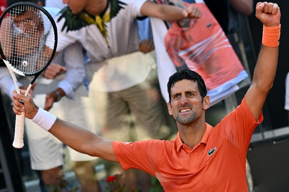 Novak Djokovic of Serbia celebrates after winning his men's singles final match against Stefanos Tsitsipas of Greece at the Italian Open tennis tournament in Rome, Italy, 15 May 2022. Ettore Ferrari, EPA-EFE.