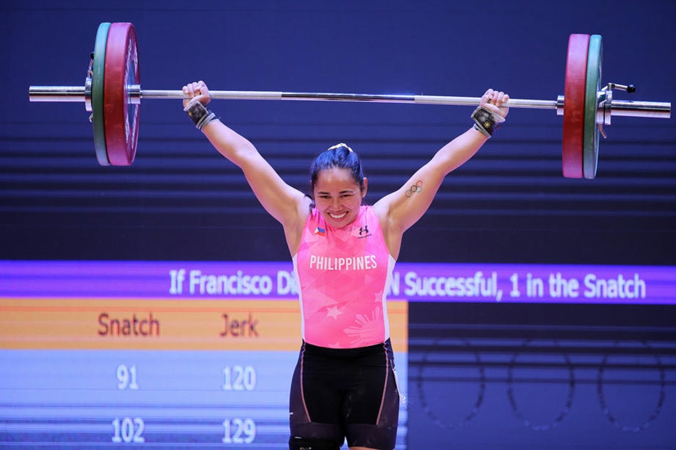 Hidilyn Diaz of the Philippines competes in the 55kg women's snatch weightlifting competition during the 31st Southeast Asian Games in Hanoi, Vietnam, May 20, 2022. Luong Thai Linh, EPA-EFE