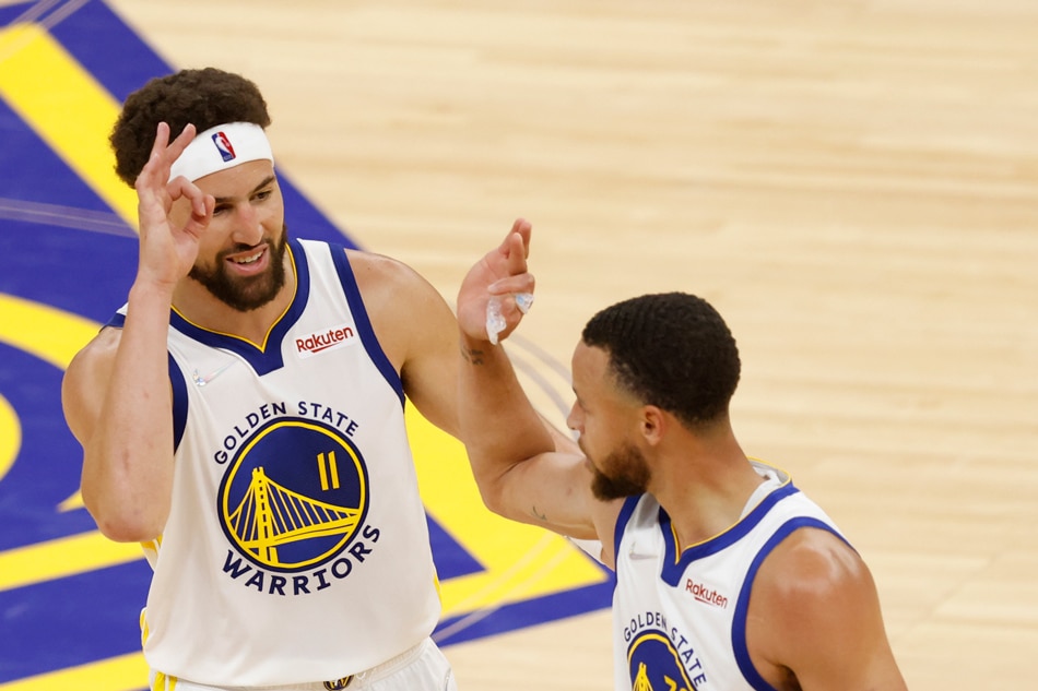 Warriors guard Stephen Curry celebrates with teammate Klay Thompson in Game 2 of their Western Conference finals on May 20, 2022. John G Mabanglo, Shutterstock Out/EPA-EFE