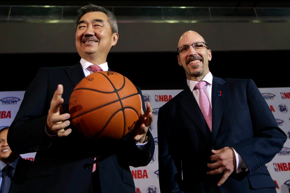 Hans Sy (L), President of SM Prime Holdings, and Scott Levy (R), Senior Vice-president and Managing Director NBA Asia pose for the media during the launch of an NBA pre-season game this year, at the Mall of Asia Arena in Pasay City , Philippines, 05 March 2013. File photo. Dennis M. Sabangan, EPA.