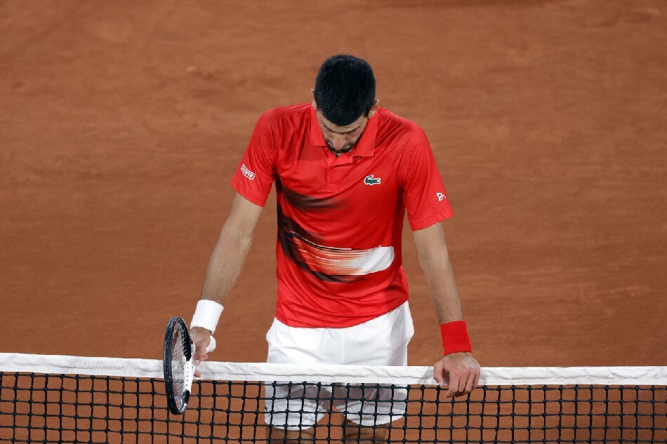 Novak Djokovic of Serbia reacts after winning against Yoshihito Nishioka of Japan in their men’s first round match during the French Open tennis tournament at Roland ​Garros in Paris, France, 23 May 2022.  Yoan Valat, EPA-EFE