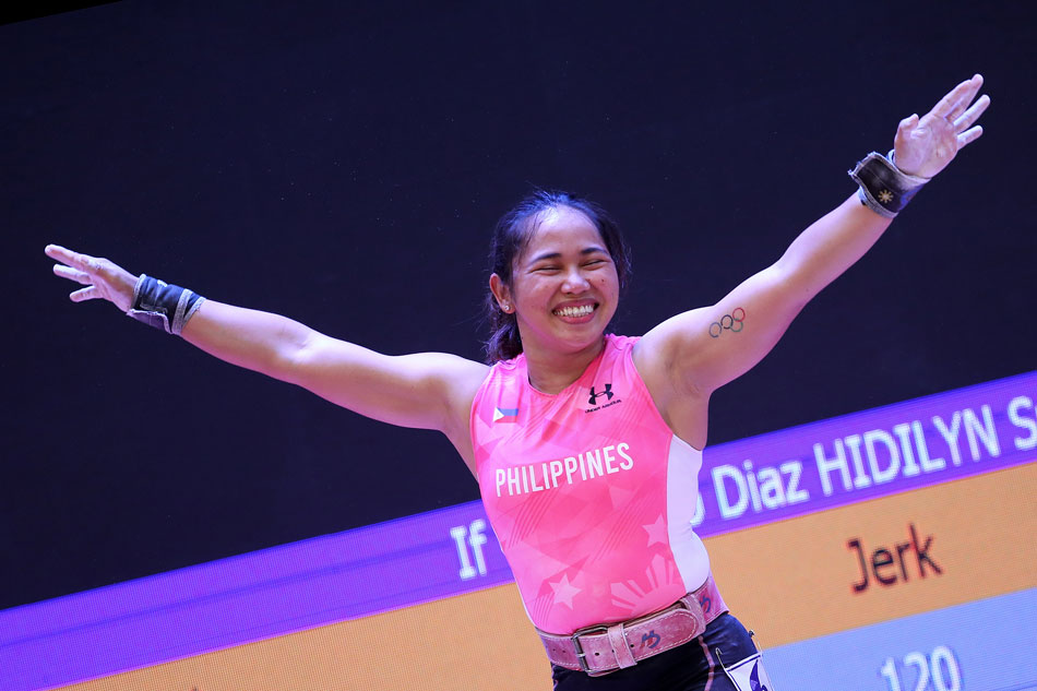 Hidilyn Diaz of Philippines reacts after competing in the 55kg women's clean and jerk weightlifting competition during the 31st Southeast Asian Games in Hanoi, Vietnam. Luong Thai Linh, EPA-EFE. 