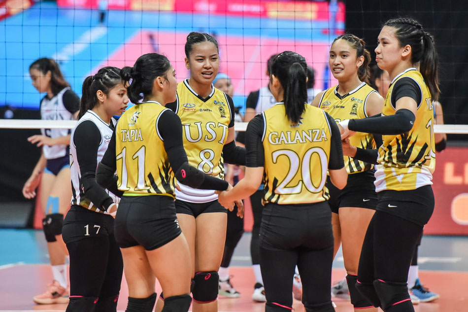 The UST Golden Tigresses celebrate after scoring against the Adamson Lady Falcons in their UAAP Season 84 second round match. UAAP Media.