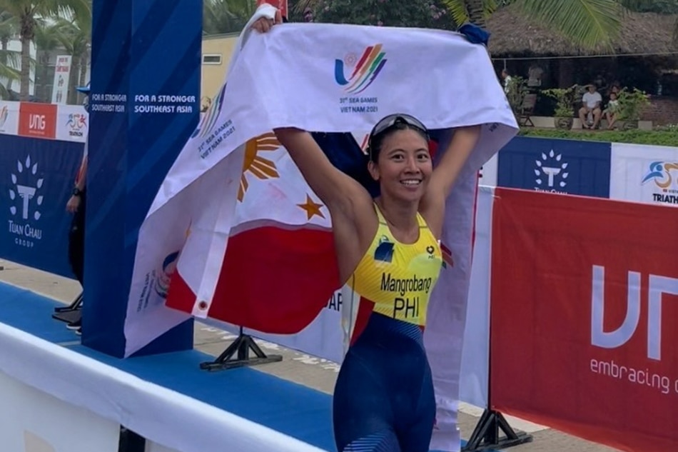 Kim Mangrobang celebrates after winning the triathlon in the 31st Southeast Asian Games in Vietnam. PSC/POC Pool Photo