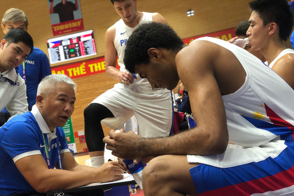  Gilas Pilipinas coach Chot Reyes gives instructions to the Filipino players during a timeout. Photo courtesy of the Samahang Basketbol ng Pilipinas.