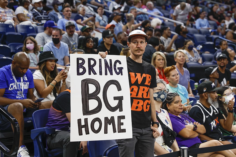 A man holds a sign Bring Brittney Griner Home during the first half of the WNBA game between the Chicago Sky and Phoenix Mercury at Wintrust Arena in Chicago, Illinois, USA, 02 July 2022. Kamil Krzaczynski, EPA-EFE.