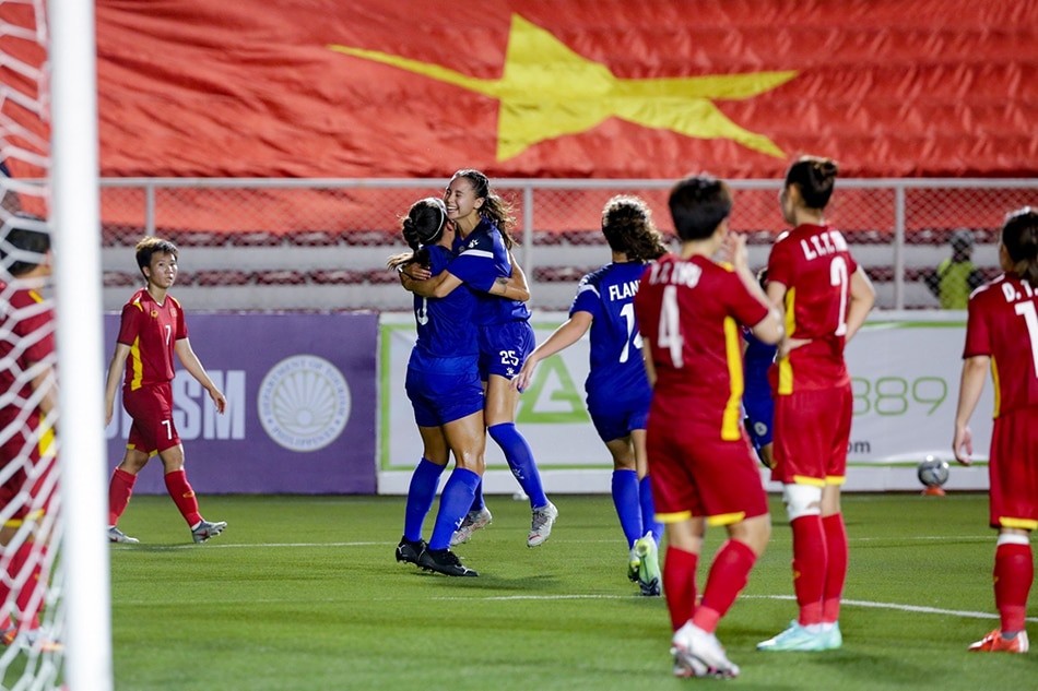 The Philippines’ Sara Eggesvik (25) hugs teammate Hali Long (5) as they celebrate after scoring a goal during their match against Vietnam for the ASEAN Football Federation Championship held at the Rizal Memorial Football Stadium in Manila on July 15, 2022. George Calvelo, ABS-CBN News