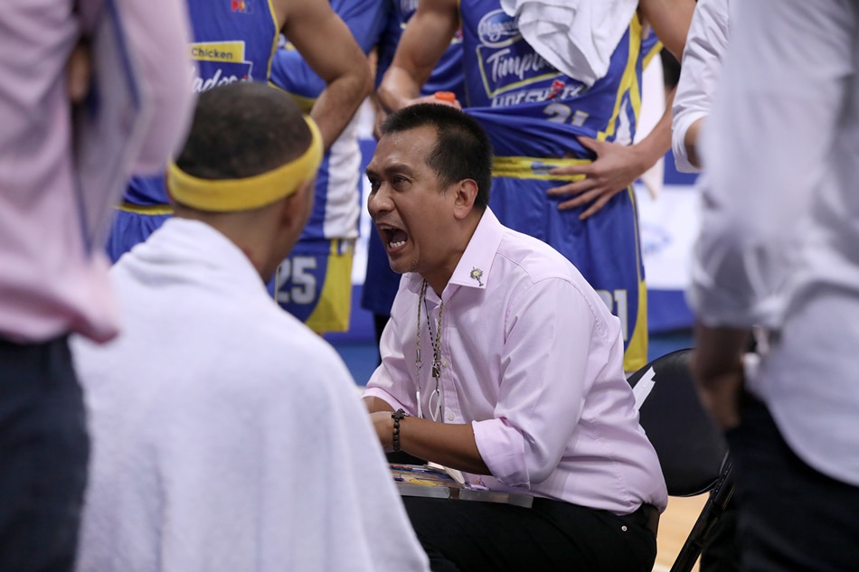 Magnolia coach Chito Victolero gives instructions during a timeout. PBA Images.
