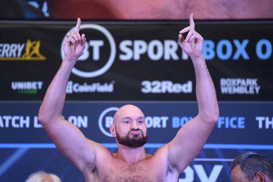Tyson Fury poses during the weigh-in for the Fury vs. Whyte fight at Wembley Box Park in London, April 22, 2022. Neil Hall, EPA-EFE/file