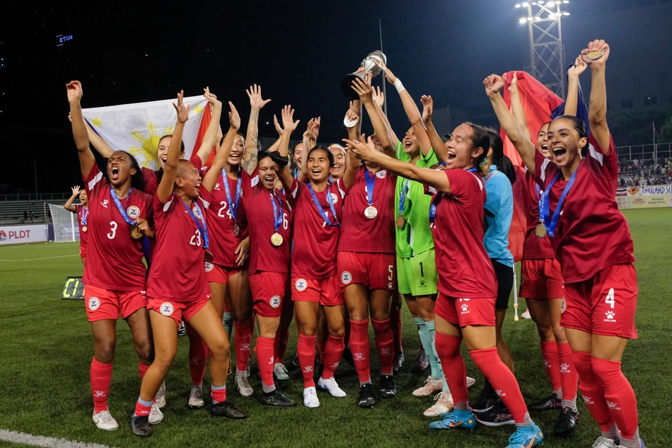 Members of the Philippine Women's National Football Team celebrate after winning the ASEAN Football Federation (AFF) Women's Championship title at the Rizal Memorial Stadium in Manila on July 17, 2022. George Calvelo, ABS-CBN News