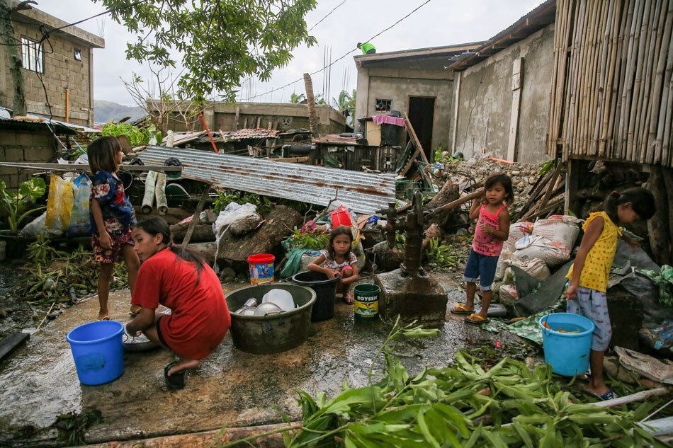 Locals clean up at Barangay Paltic in Dingalan, Aurora a day after Super typhoon Karding made landfall in Dingalan with maximum sustained winds of 185 kph near the center at 8:20 PM on Sunday. Jonathan Cellona, ABS-CBN News