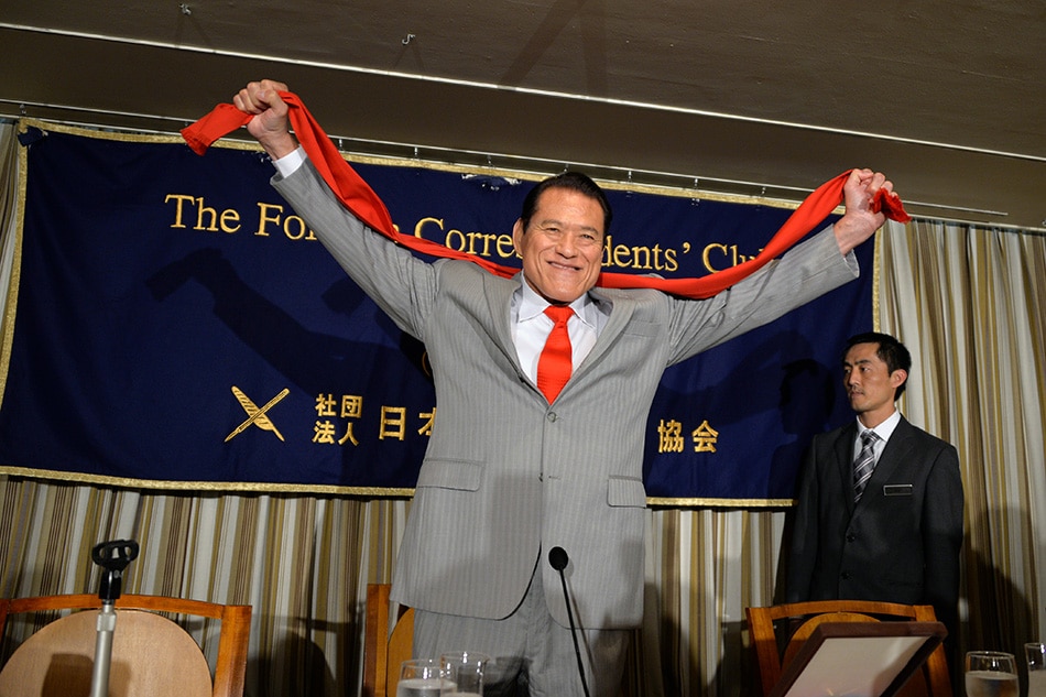 Japanese wrestler-turned-politician Antonio Inoki gestures upon his arrival at a press conference at the Foreign Correspondents' Club of Japan in Tokyo, Japan, 21 August 2014 (reissued 01 October 2022). File photo. Franck Robichon, EPA-EFE.