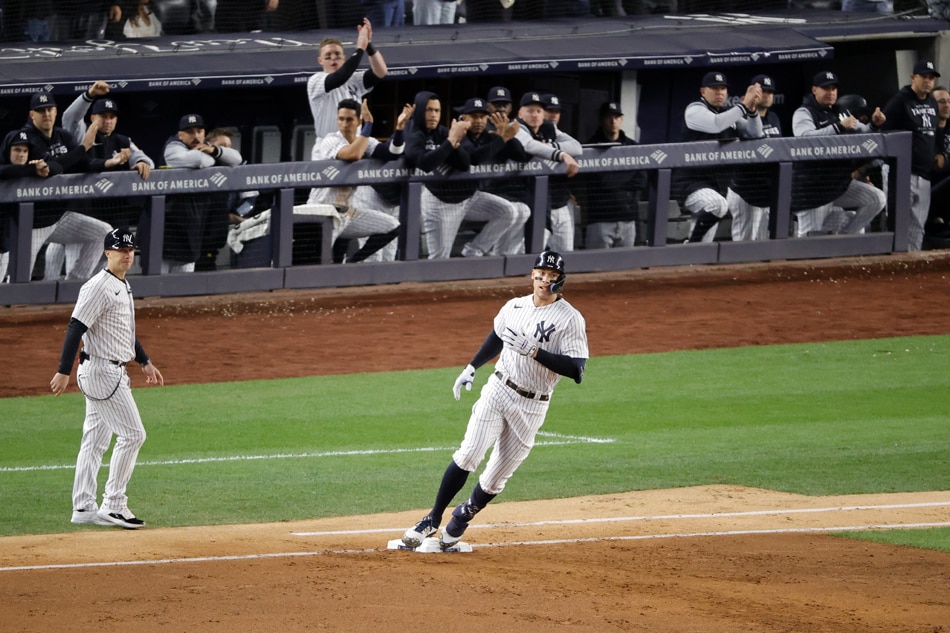 New York Yankees right fielder Aaron Judge (C) steps on first base after hitting a single to shallow center field on a pitch from Baltimore Orioles starting pitcher Jordan Lyles (Not Pictured) in the third inning of their MLB game at the Yankees Stadium in the Bronx borough of New York, New York, USA, 30 September 2022. Jason Szenes, EPA-EFE