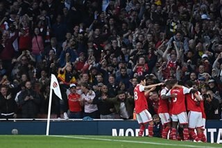 Football: Arsenal beat Liverpool to go top