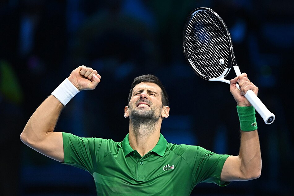 Novak Djokovic of Serbia celebrates after winning the match against Stefanos Tsitsipas of Greece at the Nitto ATP Finals 2022 tennis tournament at the Pala Alpitour arena in Turin, Italy, 14 November 2022. Alessandro di Marco, EPA-EFE.