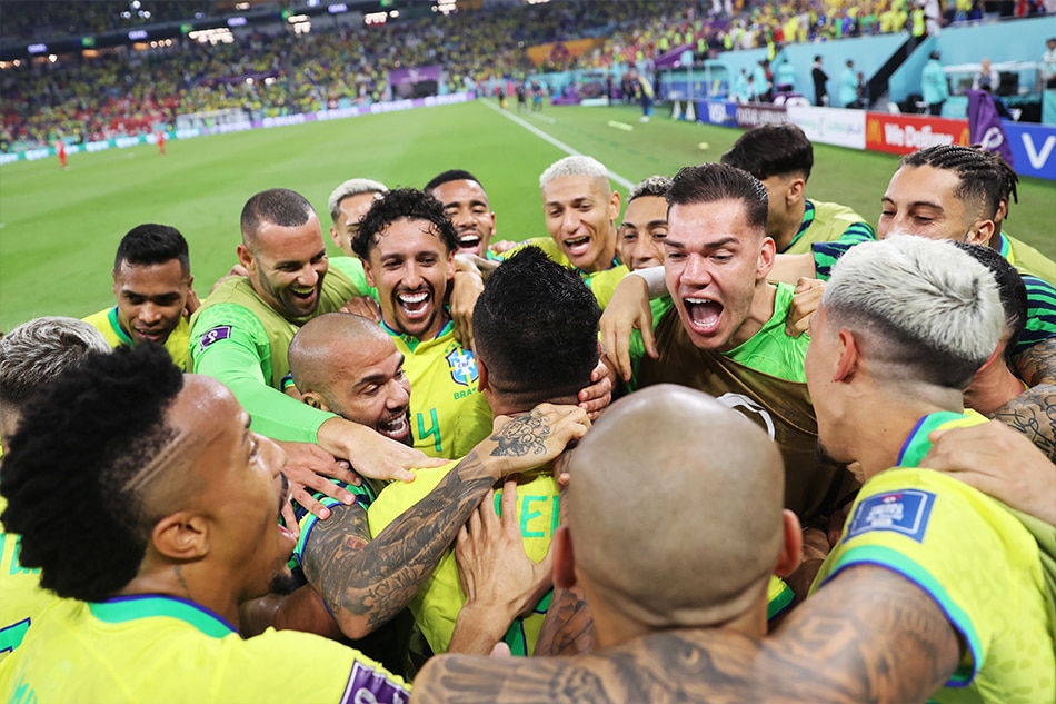 Players of Brazil surround Casemiro (C) of Brazil as they celebrate his 1-0 goal during the FIFA World Cup 2022 group G soccer match between Brazil and Switzerland at Stadium 947 in Doha, Qatar, 28 November 2022. EPA-EFE/Tolga Bozoglu