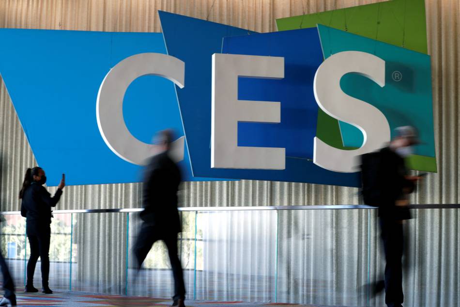 Attendees pass by a CES sign during CES 2022 in Las Vegas, Nevada, US January 6, 2022. Steve Marcus, Reuters