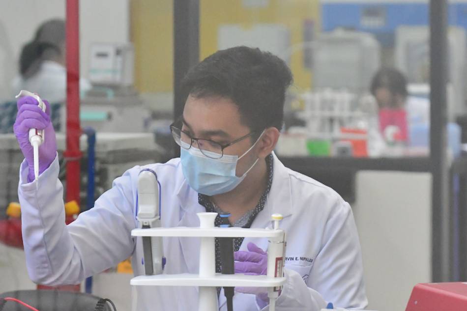 Researchers work in a laboratory at the Philippine Genome Center on March 12, 2020. Mark Demayo, ABS-CBN News