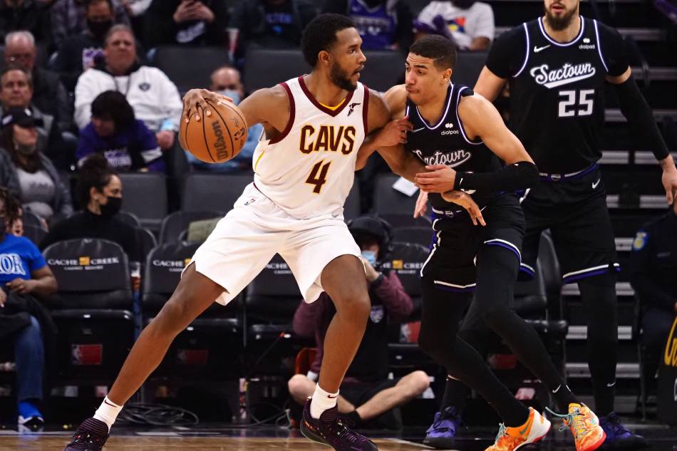 Cleveland Cavaliers forward-center Evan Mobley (4) controls the ball abasing Sacramento Kings guard Tyrese Haliburton (0) during the third quarter at Golden 1 Center. Kelley L Cox, USA TODAY Sports/Reuters.