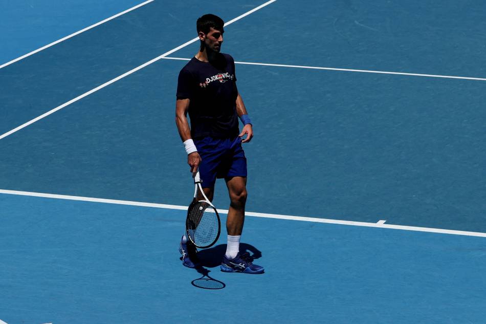 Serbian tennis player Novak Djokovic practices at Melbourne Park as questions remain over the legal battle regarding his visa to play in the Australian Open in Melbourne, Australia, January 12, 2022. Loren Elliott, Reuters.