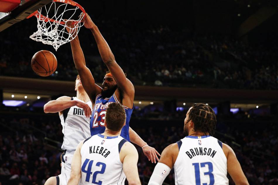 New York Knicks center Mitchell Robinson (23) dunks the ball against the Dallas Mavericks during the second half at Madison Square Garden. Andy Marlin, USA TODAY Sports/Reuters.