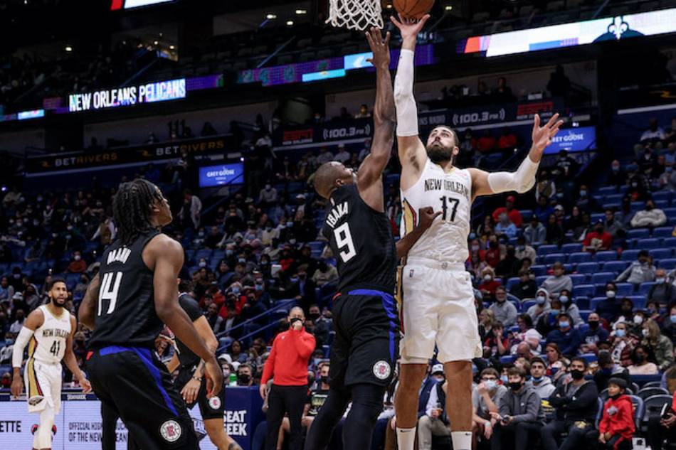 New Orleans Pelicans center Jonas Valanciunas (17) shoots a jump shot against LA Clippers center Serge Ibaka (9) at the Smoothie King Center. Stephen Lew, USA TODAY Sports/Reuters