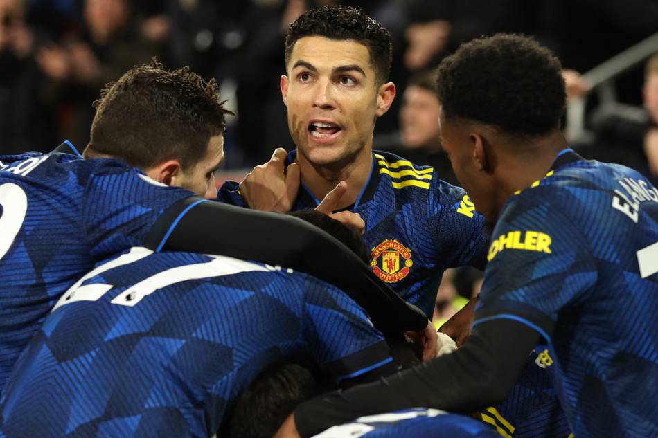 Manchester United's Cristiano Ronaldo celebrates with teammates after Mason Greenwood scores their second goal. Ian Walton, Reuters.