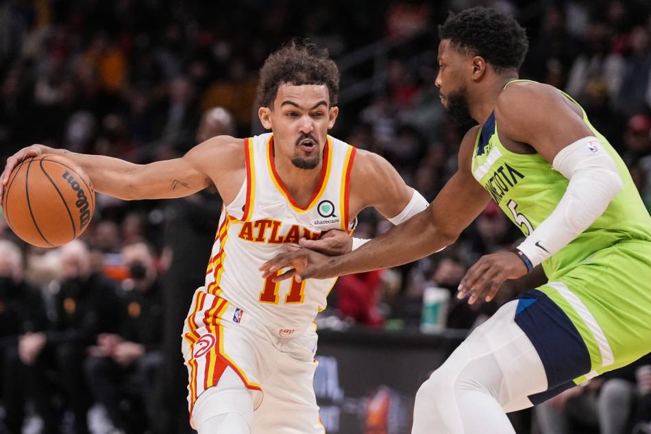 Atlanta Hawks guard Trae Young (11) dribbles the ball against Minnesota Timberwolves guard Malik Beasley (5) during the second half at State Farm Arena. Dale Zanine, USA TODAY Sports/Reuters.
