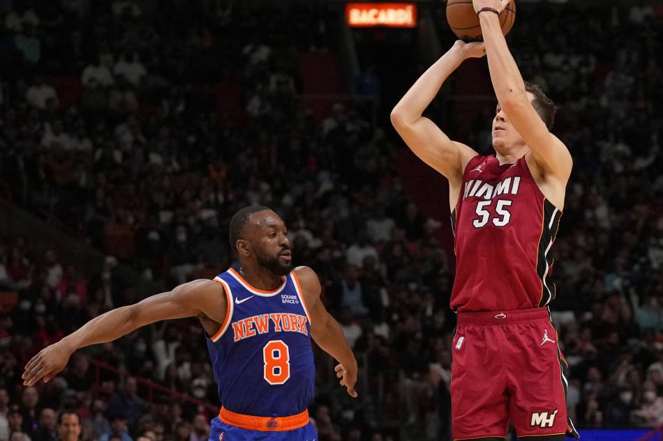 Miami Heat guard Duncan Robinson (55) attempts a three point shot in front of New York Knicks guard Kemba Walker (8) during the second half at FTX Arena. Jasen Vinlove, USA TODAY Sports/Reuters.