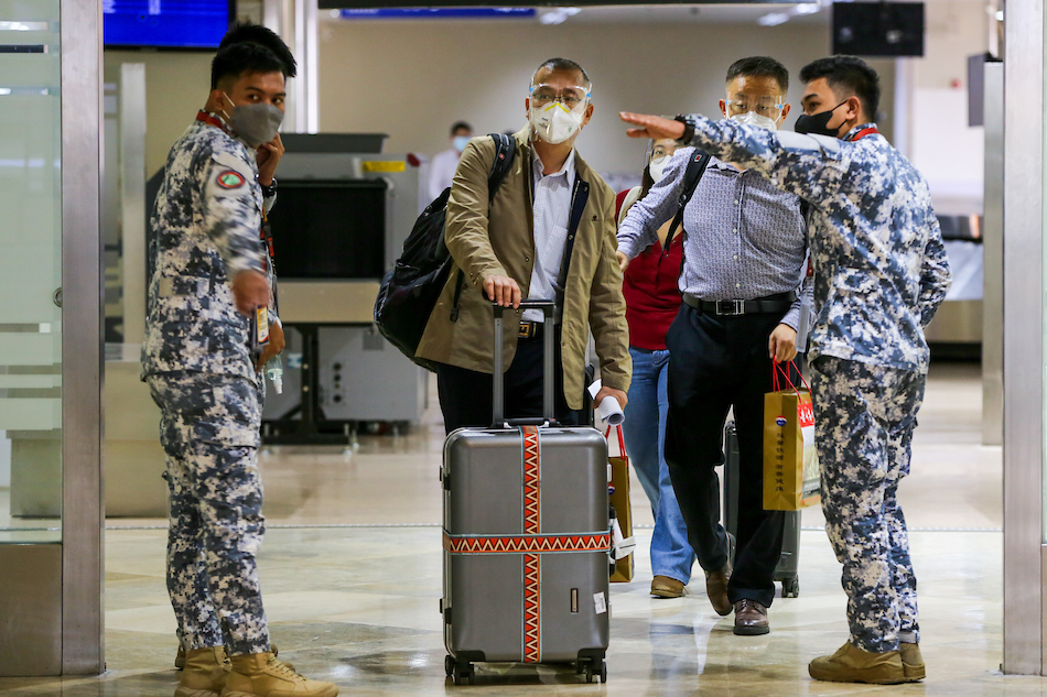 Foreign nationals arrive at Manila's main airport on February 10, 2022, the first day the country reopened its borders to fully vaccinated international tourists and business travelers. Jonathan Cellona, ABS-CBN News