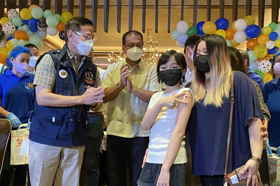 A child is vaccinated against COVID-19 at a Parañaque Hotel as government expands the nationwide the rollout of COVID-19 vaccines to children ages 5 to 11. Feb. 14, 2022. Wena Cos, ABS-CBN News