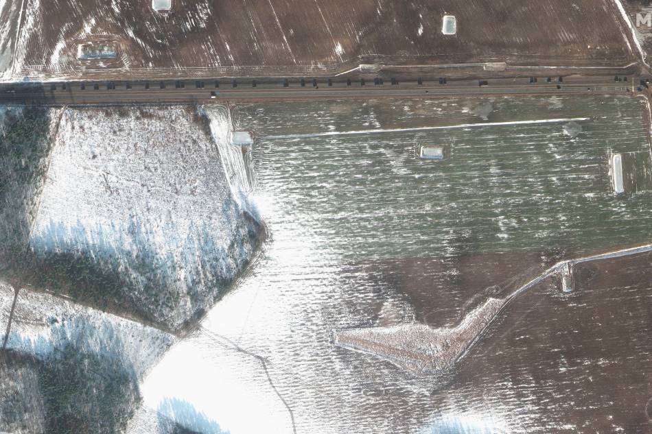 A satellite image shows a military convoy westbound from Rechitsa, Belarus February 16, 2022. Picture taken February 16, 2022. Maxar Technologies/Handout via Reuters