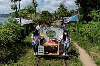 Trolley school helps Philippine children keep studies on track