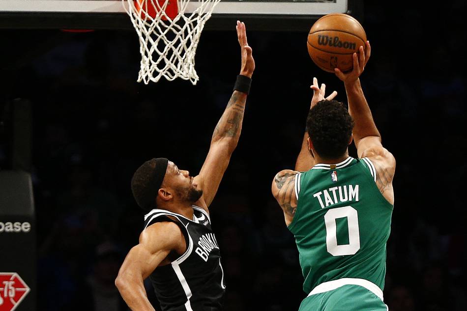 Boston Celtics forward Jayson Tatum (0) takes a shot against Brooklyn Nets forward Bruce Brown (1) during the first half at Barclays Center. Andy Marlin, USA TODAY Sports/Reuters.