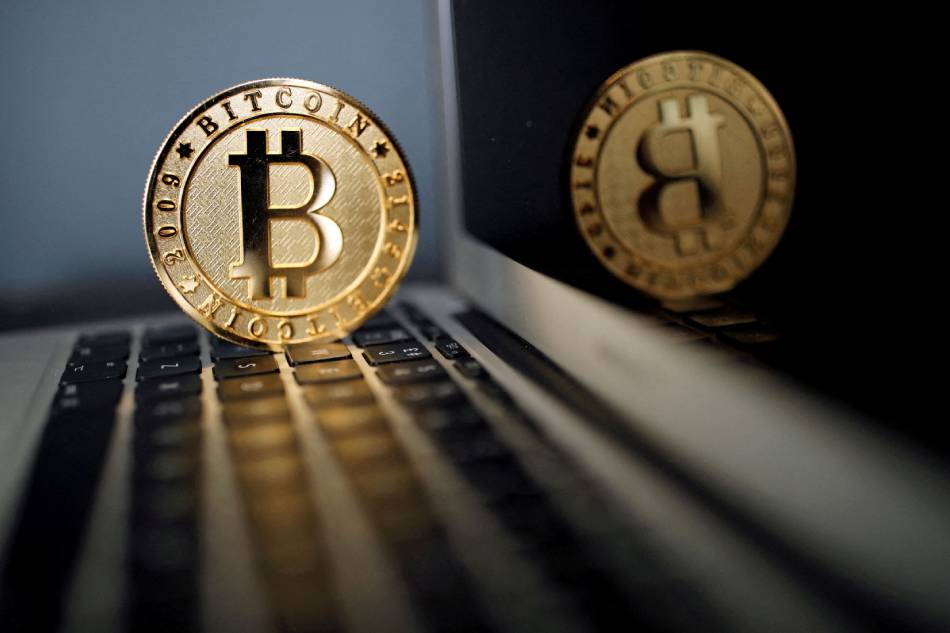 A bitcoin is seen in an illustration picture taken at La Maison du Bitcoin in Paris, France, June 23, 2017. Benoit Tessier, Reuters/File Photo