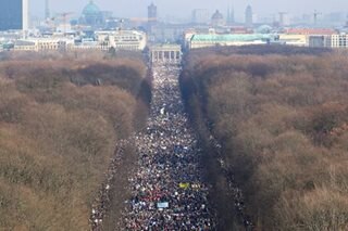 'Glory to Ukraine': Hundreds of thousands march against Russian invasion