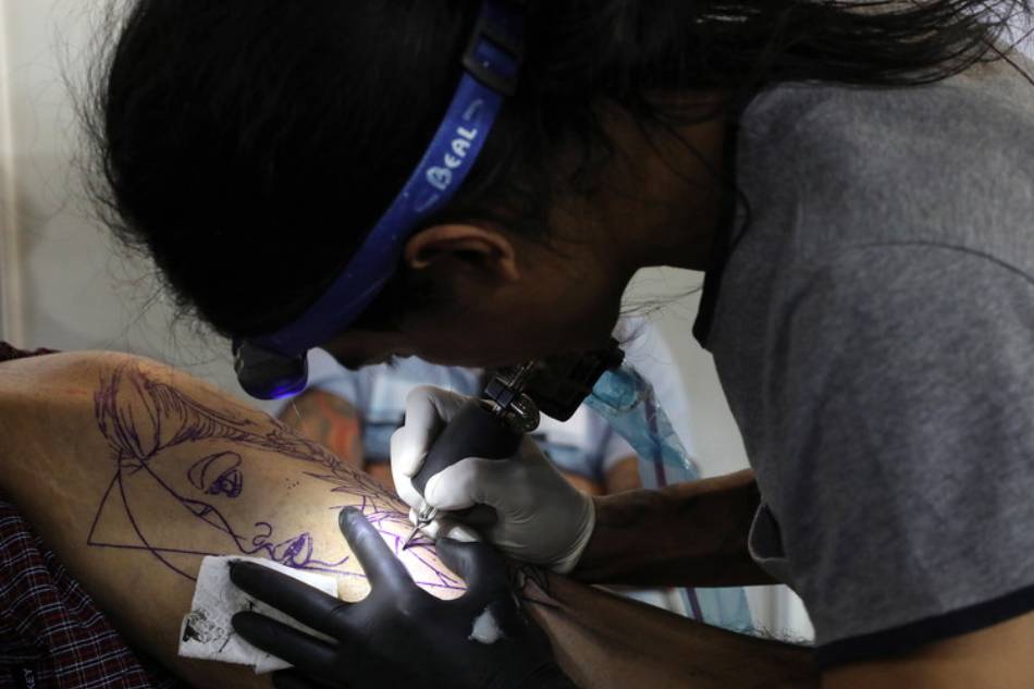 South Korean tattooists fume after court upholds ban | ABS-CBN News