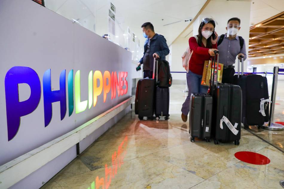Foreign nationals arrive at the Ninoy Aquino International Airport in Pasay City on February 10, 2022, the first day the country reopened its borders to fully vaccinated international travelers. Jonathan Cellona, ABS-CBN News