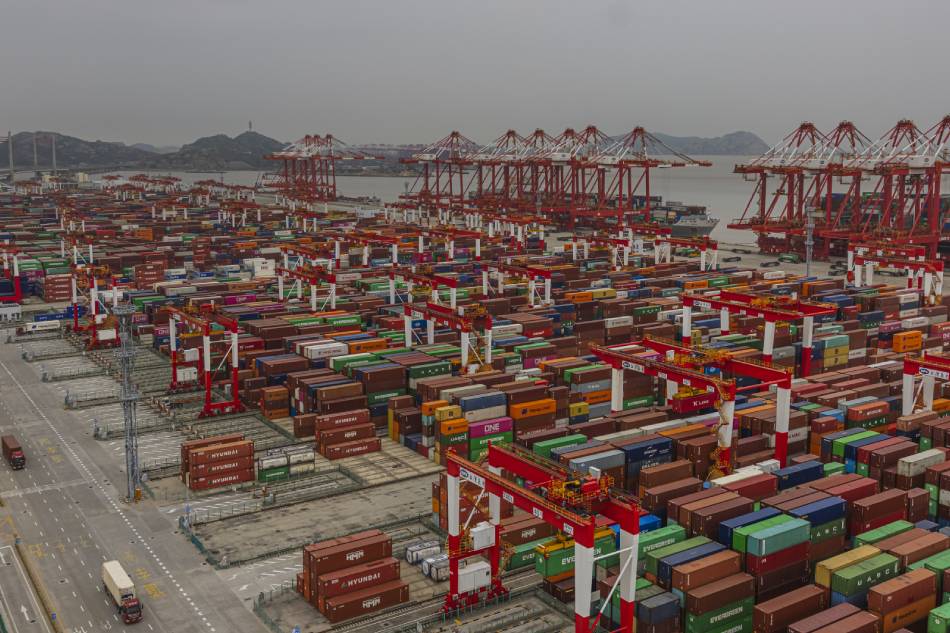 A cargo containers are being loaded to the cargo ship in Yangshan Phase IV Automated Terminal, in Yangshan, Shanghai, China, June 17, 2021. Alex Plavevski, EPA-EFE