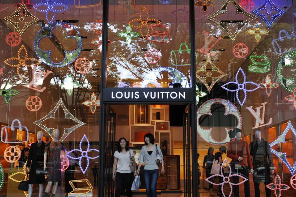 Shoppers walk out of a Louis Vuitton store at Tokyo's Omotesando fashion district, in Japan, 10 September 2009. Franck Robichon, EPA-EFE
