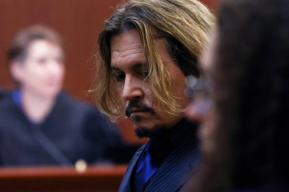 Actor Johnny Depp attends the 50 million US dollars Depp vs Heard defamation trial at the Fairfax County Circuit Court in Fairfax, Virginia, USA, April 13, 2022. Evelyn Hockstein, EPA-EFE/Pool 